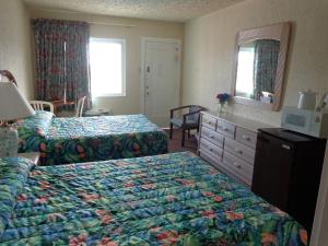 Voodi või voodid majutusasutuse Fountain Motel toas