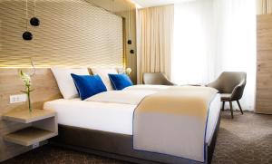 Postel nebo postele na pokoji v ubytování Hotel Atlas Leipzig