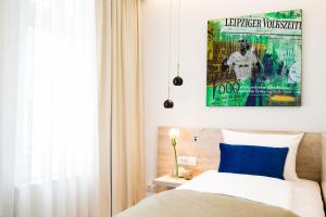 Postel nebo postele na pokoji v ubytování Hotel Atlas Leipzig