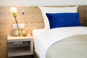 Postel nebo postele na pokoji v ubytování Hotel Atlas Leipzig