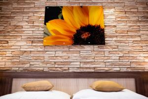 Postel nebo postele na pokoji v ubytování Hotel Viktor