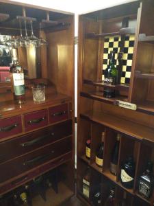 a wine cellar filled with bottles and wine glasses at Hotel Deutscher Kaiser in Nuremberg