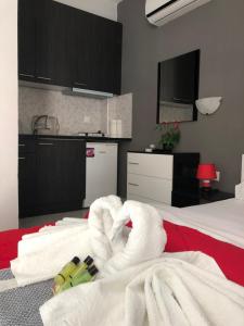 Postel nebo postele na pokoji v ubytování Niriides Rooms