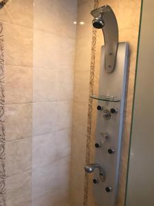 a bathroom with a shower with a shower head at Център in Pleven