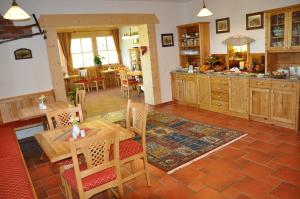 a kitchen and dining room with a table and chairs at s´ Kellerstöckl in Loipersdorf bei Fürstenfeld