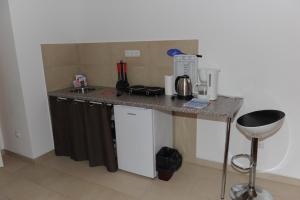Kuchyň nebo kuchyňský kout v ubytování Apartmani Ivišić