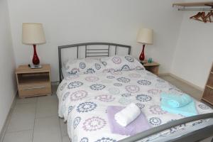 Postel nebo postele na pokoji v ubytování Apartmani Ivišić