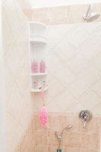 a bathroom with a shower with a faucet at Bed & Breakfast Santa Caterina in Ercolano