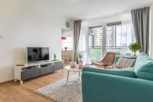 Televízia a/alebo spoločenská miestnosť v ubytovaní Hendrix Bridge Apartment 2