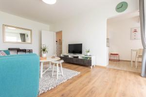 Televízia a/alebo spoločenská miestnosť v ubytovaní Hendrix Bridge Apartment 2