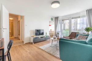 Televízia a/alebo spoločenská miestnosť v ubytovaní Hendrix Bridge Apartment 2