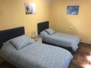 Postel nebo postele na pokoji v ubytování Casa rural “Las Espinosas”