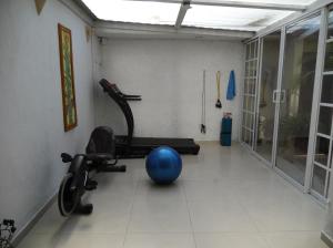 a room with a gym with a blue ball in it at Casa Culhuac in Mexico City