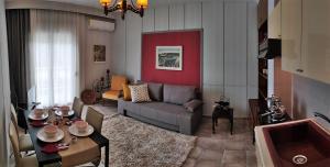 a living room with a couch and a table at Cozy apartments in Komotini