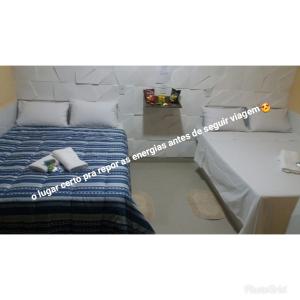 Una cama o camas en una habitación de POUSADA EXECUTIVE EXPRESS