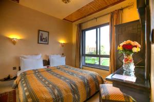 Postel nebo postele na pokoji v ubytování Amani Hotel Suites & Spa