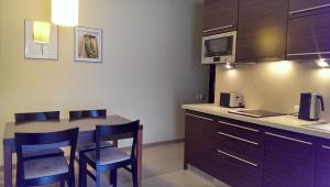 Kuchyň nebo kuchyňský kout v ubytování APARTAMENT JULIA