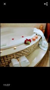 a bath tub filled with towels and a red at Lasa Valley Villa in Lasa