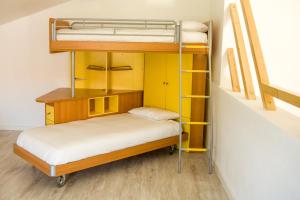 Un pat sau paturi într-o cameră la Casa das Pipas #1