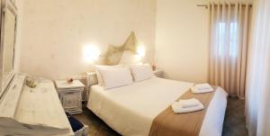 Posteľ alebo postele v izbe v ubytovaní Paros Paradise Apartments
