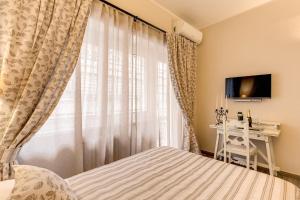 Postel nebo postele na pokoji v ubytování Casa Mia Vaticano Guest House