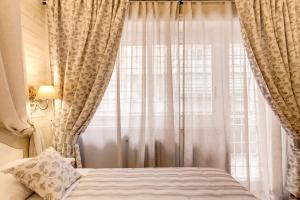 Postel nebo postele na pokoji v ubytování Casa Mia Vaticano Guest House