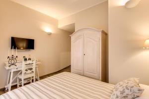 Postel nebo postele na pokoji v ubytování Casa Mia Vaticano Guest House