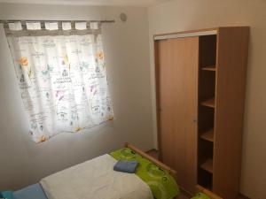 Postel nebo postele na pokoji v ubytování Apartmani BAU BAB