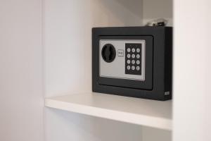 a microwave on a shelf in a room at Center Luxury Rooms 3 in Split