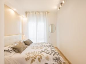 a bedroom with a bed and a window at Panorama Fantastico sul golfo degli angeli in Su Forti