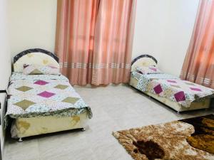Postel nebo postele na pokoji v ubytování الجبل الاخضر Isterahat AlJabel alakhdar