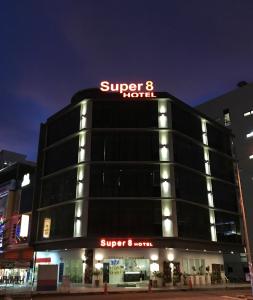 a building with a super hotel sign on it at Super 8 Hotel @ Bayan Baru in Bayan Lepas