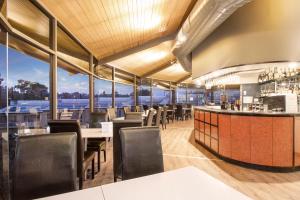 a restaurant with a view of the water at Mantra Bathurst in Bathurst