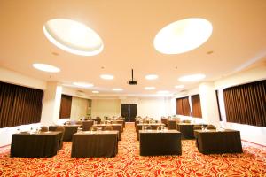 a conference room with tables and chairs in it at Tebu Hotel Bandung in Bandung +27 photos