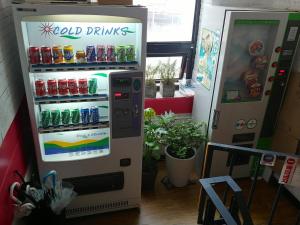 a vending machine with sodas and drinks on it at Choco Residence in Seoul