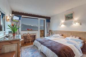 Letto o letti in una camera di Hotel Ad'Eldorado