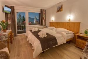 Letto o letti in una camera di Hotel Ad'Eldorado