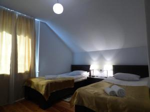Ένα ή περισσότερα κρεβάτια σε δωμάτιο στο Anano Guest House