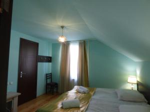 Ένα ή περισσότερα κρεβάτια σε δωμάτιο στο Anano Guest House