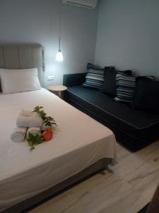 Postel nebo postele na pokoji v ubytování Aegialis Apartments (Dimitros)