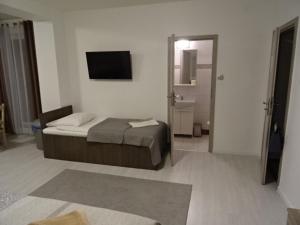 Postel nebo postele na pokoji v ubytování Villa Eleven