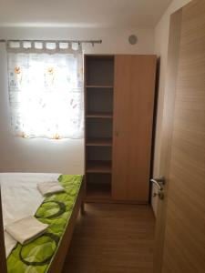 Postel nebo postele na pokoji v ubytování Apartmani BAU BAB
