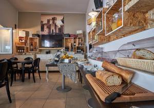 a bakery with bread on a table in a room at Villaggio Turistico Lugana Marina in Sirmione