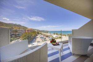 a balcony with a view of the ocean at Victoria Palace Cefalù in Cefalù