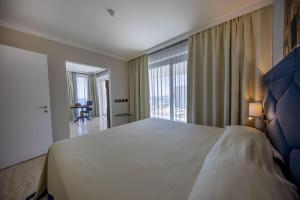 Victoria Palace Cefalù客房内的一张或多张床位