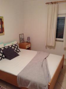 Postel nebo postele na pokoji v ubytování Apartments Edina