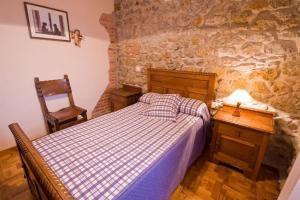 Łóżko lub łóżka w pokoju w obiekcie Vivienda Casa Luisa