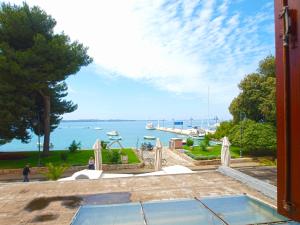 a view of the ocean from a house at Apartment Mile 1872 in Fažana