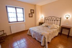 Łóżko lub łóżka w pokoju w obiekcie Vivienda Casa Luisa