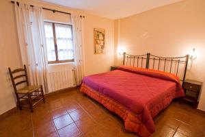 Łóżko lub łóżka w pokoju w obiekcie Vivienda Casa Luisa